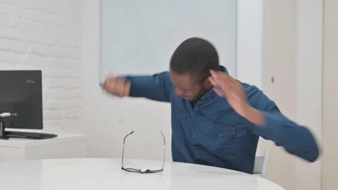 Middle Aged African Man with Headache Sitting at Work Video stock 309513504