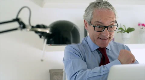 Middle aged and good looking business man in a modern office. Stock Footage 62649277