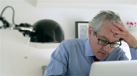 Middle aged and good looking business man in a modern office. Stock Footage 62649364