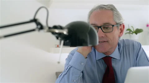 Middle aged and good looking business man, talk at mobile phone. Stock Footage 62650980