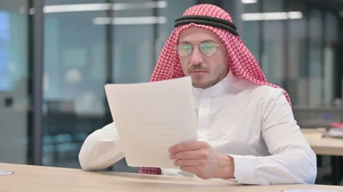 Middle Aged Arab Man Reading Documents in Office Video stock 152523819