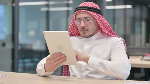 Middle Aged Arab Man using Tablet in Office Stock Footage 152523351