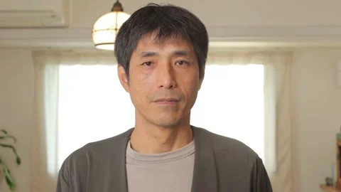 Middle aged asian man opens his eyes and stares the camera. Emotionless. 25P. Stock Footage 224899810