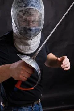 Middle aged bearded man with epee and helmet Stock Photos