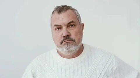 Middle aged bearded man looks to camera Stock Footage 70751521