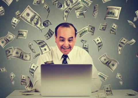Middle aged business man using a laptop building online business making money Stock Photos