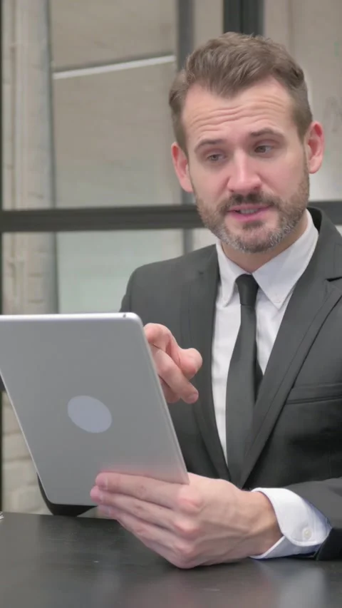 Middle Aged Businessman Doing Video Chat on Tablet, vertical video Stock-Footage 324794764