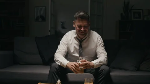 Middle Aged Businessman Drinking Alcohol to Cope with Work Stress Stock Footage 344866371