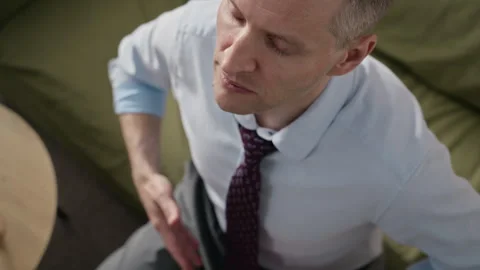 Middle-aged Businessman Practicing Breathing Exercise in Therapy Stock Footage 340630450