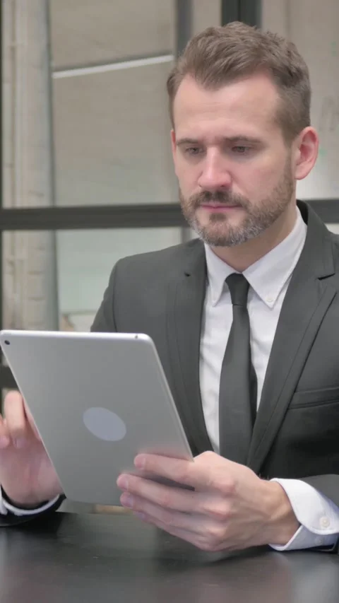 Middle Aged Businessman Using Digital Tablet, vertical video Stock Footage 324794378