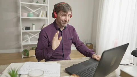 Middle aged Caucasian man making victory gesture and dancing after waving Stock Footage 150657309