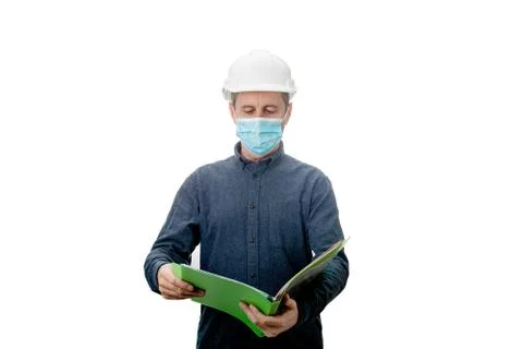 Middle aged Contractor or architect  holding a notepad, wearing protective he Stock Photos