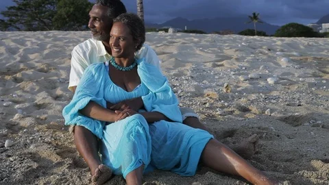 Middle-aged couple embracing on a beach. 스톡 동영상 88371781