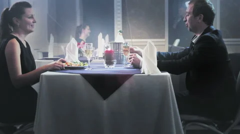 A MIDDLE-AGED COUPLE HAVING DINNER Stock Footage 57326450