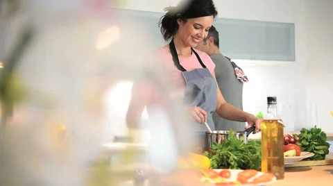 Middle-aged couple having fun cooking together Stock-Footage 61479462