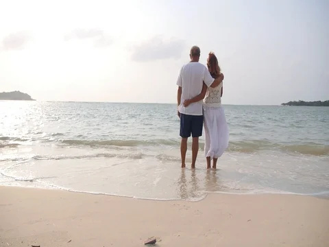 Middle-Aged Couple Hugging on The Beach On Vacation Video stock 75634978
