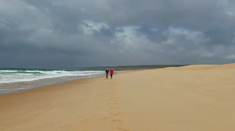 Middle-aged Couple Jogging on Beach Stock Footage 45507419