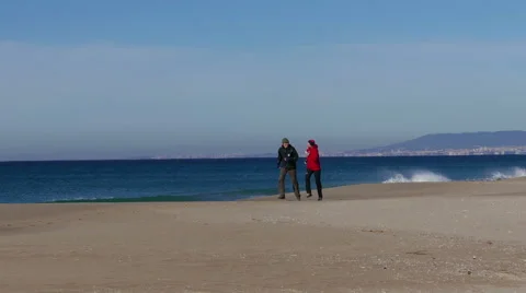 Middle-aged Couple Jogging on Beach Stock Footage 45576031