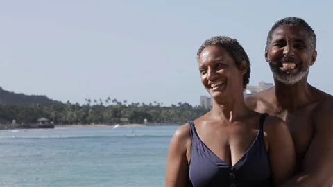 Middle-aged couple laughing on a beach. Stock-Footage 88367482