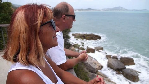 Middle-Aged Couple Looking at Sea Stockbeeldmateriaal 73927481