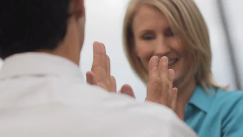 Middle-aged couple playing a clapping game. Stock Footage 88371299