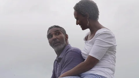 Middle-aged couple talking and smiling. 動画素材 88369595