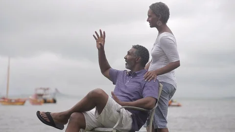 Middle-aged couple talking by the sea. 스톡 동영상 88369623