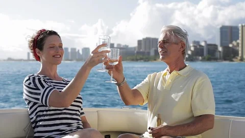 Middle-aged couple toasting on a boat. Stock Footage 88370710