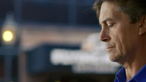 Middle-aged couple use a laptop and tablet at an outdoor cafe. Stock Footage 59746750