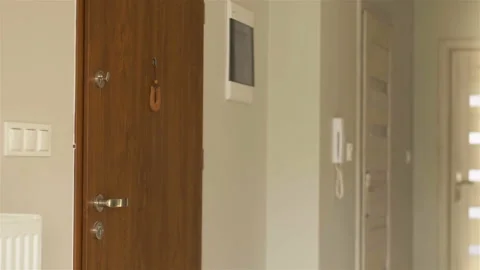 Middle aged couple visiting their granddaughter, grandchild greeting her Stock Footage 121173515