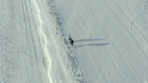 Middle-aged couple in winter clothes hiking Stock Footage 149781155