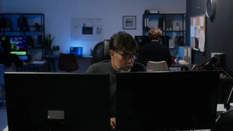 Middle Aged Cybersecurity Analyst Working on Computer in Office Stock Footage 347293649