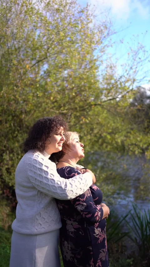 A   middle-aged daughter and elderly mother together on a walk in the autum.. Stock Footage 289284831