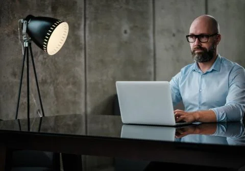 Middle-aged designer working in office Stock Illustration