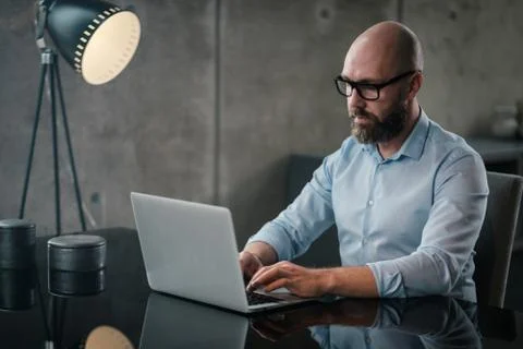 Middle-aged designer working in office Stock Illustration