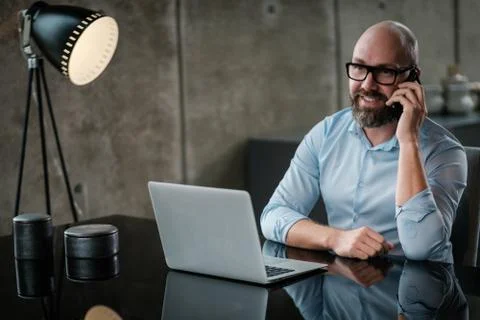 Middle-aged designer working in office Illustrazione stock