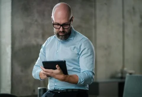 Middle-aged designer working in office Stock Illustration