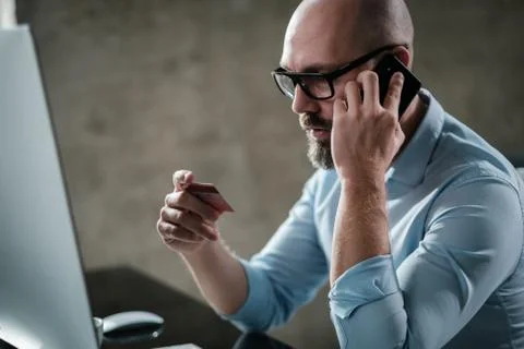 Middle-aged designer working in office Stock Illustration