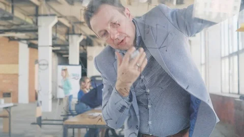 A middle-aged developer in a business suit thinks for a long time, after which Stock Footage 108982198