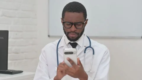 Middle Aged Doctor Using Smartphone for Work Video stock 310177841