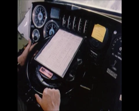 Middle-aged engine driver balancing speed and braking, United Kingdom 1972 Video stock 133273730