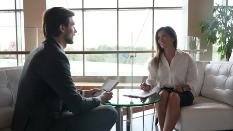 Middle-aged female manager talking to business colleague in office, sharing idea Stock Footage 224497324