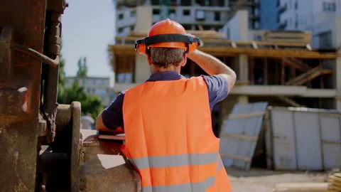 Middle-aged foreman at construction site analyzing the work of the building Stock Footage 146598740