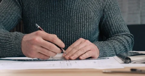 Middle aged Handsome Architect working at his Office with Ruler and Pencil Stock Footage 126245228
