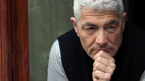 Middle aged handsome man over thinking about his problems and worries Stock-Footage 74684242