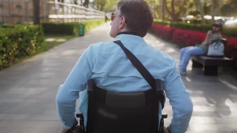 Middle aged happy man walking on the street, disabled handsome man outdoor. 스톡 동영상 260235649