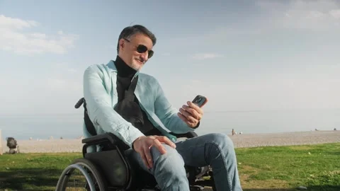 Middle aged hispanic man smiling confident having video call at street on sea Stock Footage 243644352