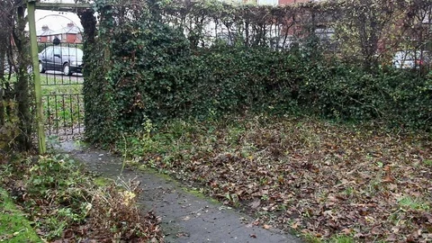 Middle aged hooded man purposefully leaves house in a rainy day in autumn Video stock 69939068