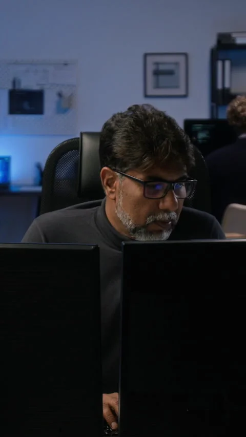 Middle Aged Indian Cybersecurity Analyst Working on Computer Stock Footage 347316269