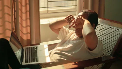 Middle Aged Indian Man Rubbing Tired Eyes While Using Laptop at Home. Stock Footage 343835005